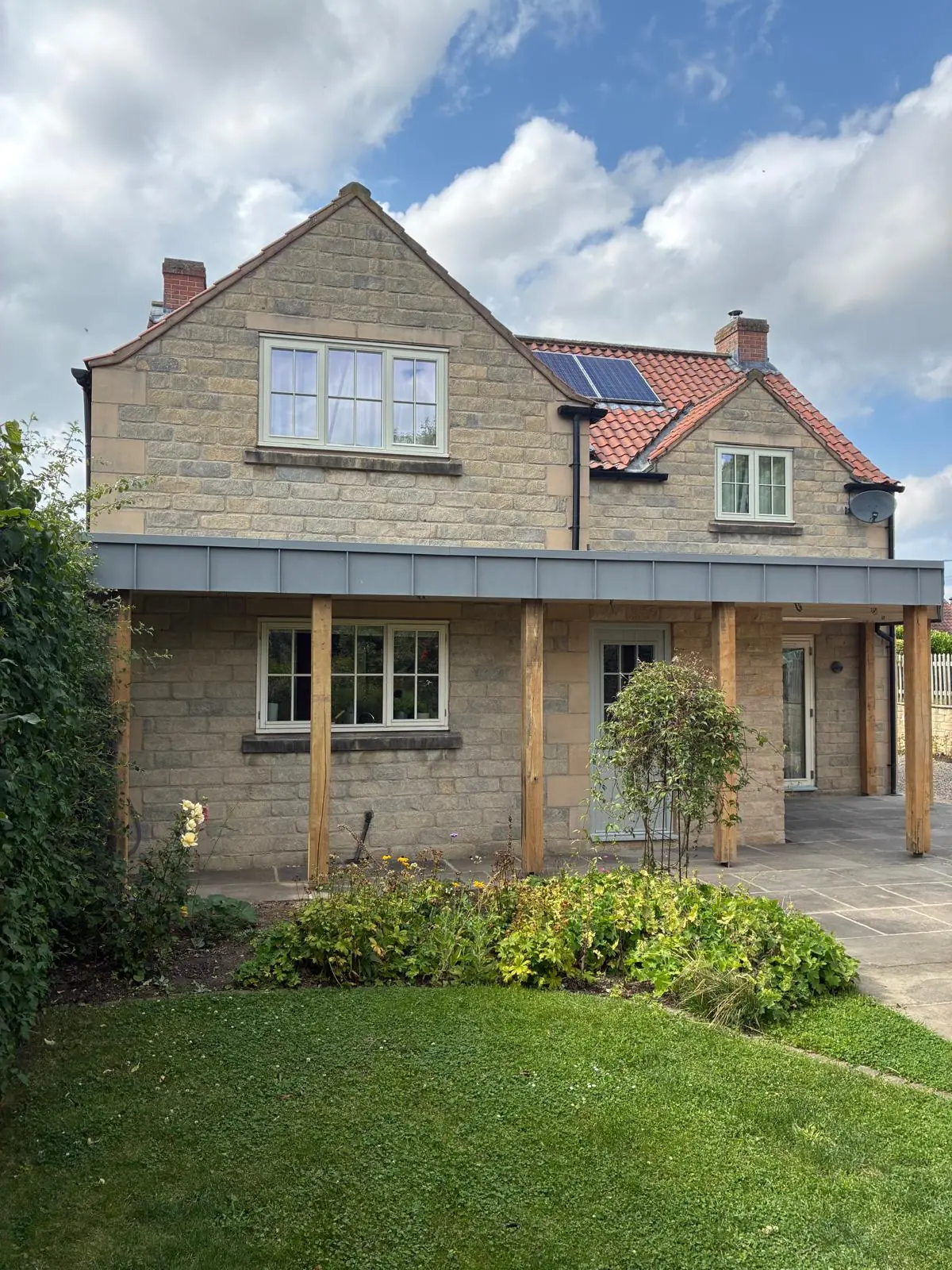 Rear sun canopy on floating oak posts with a grey Prefa aluminium fascia, Kirkbymoorside