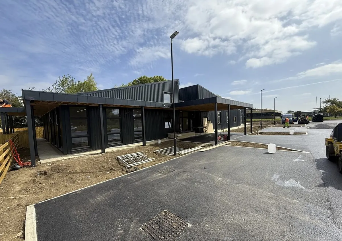 The finished Ryedale Special Families headquarters with its dark cladding, covered entrance and new car park